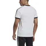 Remera blanca de algodón con cuello redondo y mangas cortas con ribete negro. Presenta las tres rayas características de Adidas en color negro en los hombros y el logo de la marca bordado en el pecho.