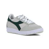 Championes Diadora modelo B.Elite ACBC, color blanco y gris con detalles en verde oscuro y suela blanca con motas multicolores.