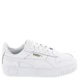 Championes Puma modelo Carina Street con plataforma, color blanco con detalles en dorado. Diseño de corte bajo con cordones y suela de goma con relieve.