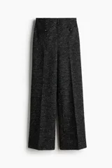 Pantalón de tiro alto de tweed negro con efecto melange, corte recto, bolsillos frontales tipo parche con botones y pliegues marcados.
