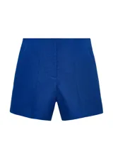 Short azul de lino con tiro medio, bolsillos laterales y diseño recto con cierre oculto.