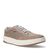 Zapatos urbanos Freeway de cuero color taupe, con diseño de capellada microperforada en los laterales, cierre de cordones y suela de goma blanca con base color caramelo.