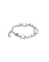 Pulsera de aleación de metales bañados en plata con diseño de estrellas y cristales facetados multicolores.