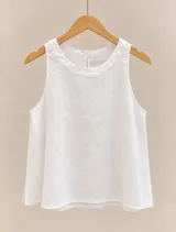 Musculosa blanca de lino, con escote redondo, silueta suelta y diseño sin mangas.