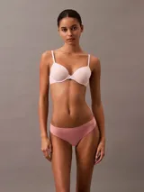 Colaless color rosa de microfibra suave con bordes cortados a láser y logo de Calvin Klein estampado en la cadera.