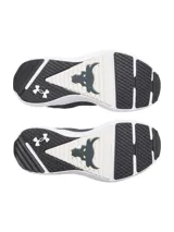 Championes de entrenamiento Under Armour Project Rock BSR 5, color negro con suela blanca. Presentan una parte superior de malla transpirable con revestimientos de gamuza, mediasuela Charged Cushioning para amortiguación reactiva y tecnología UA TriBase para mayor estabilidad y contacto con el suelo.