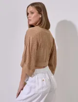 Bolero calado negro de poliéster con mangas 3/4 y frente abierto con lazo.