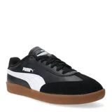 Championes urbanos Puma modelo 9T W, color blanco con detalles en negro y puntera de gamuza en tono beige. Presenta suela de goma color caramelo y logo de la marca en dorado.