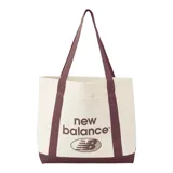 Bolso de mano New Balance, modelo Mono Canvas Tote, color crema con detalles en marrón. Presenta el logo de la marca estampado en el frente, bolsillo externo y asas de transporte en color marrón.