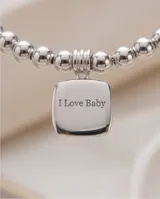 Pulsera de plata 925 compuesta por pequeñas esferas metálicas y un dije colgante de forma cuadrada con la inscripción I Love Baby.