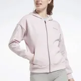 Campera con capucha Reebok de mujer, color lila, con cierre frontal completo, bolsillos tipo canguro y ribetes con el logo de la marca en las mangas. Corte oversize.