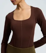 Body de manga larga marca Blue Steel, confeccionado en poliamida seamless con escote cuadrado y cierre en la entrepierna.