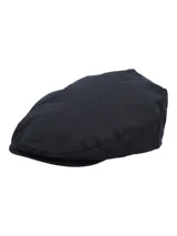 Boina estilo flat cap en color azul marino, confeccionada en canvas engrasado impermeable de alta resistencia con forro interior de algodón orgánico.