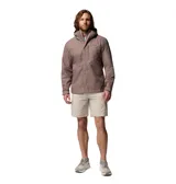 Campera impermeable Columbia modelo Hikebound II, color gris, con capucha ajustable y cierre frontal. Presenta el logo de la marca bordado en el pecho.
