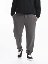Pantalon de jogging de felpa color gris, con cintura elástica ajustable mediante cordón y puños elásticos en los tobillos.