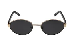 Lentes de sol Fausta modelo Donna 1265, con armazón ovalado de metal dorado y patillas negras. Lentes oscuros con protección solar.