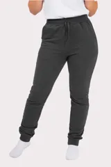 Pantalón de jogging unisex de felpa, color verde oscuro, con cintura elástica con cordón de ajuste y puños elásticos en los tobillos.
