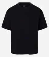 Remera de algodón con cuello redondo y mangas cortas, de corte overboxy holgado y diseño liso.