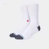 Medias blancas con logo rojo y puntera gris jaspeada con una línea verde.