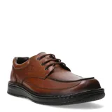 Zapato de hombre Lombardino, confeccionado en cuero color marrón con acabado brillante. Presenta diseño de costuras reforzadas en la puntera, cierre mediante cordones y suela de goma negra con textura antideslizante.