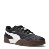 Championes urbanos Puma modelo Tifosi, color negro con detalles en blanco y suela de goma color marrón. Presentan diseño acolchado en la puntera y logo de la marca en dorado.