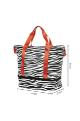 Bolso tipo tote con estampado de cebra en blanco y negro, con doble compartimento y asas de color naranja.