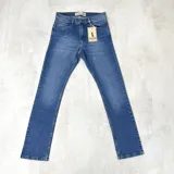 Jean de calce skinny color azul con efecto localizado, cinco bolsillos y doble pasa cinto.