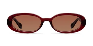 Lentes de sol ovalados color marrón, con montura de acetato color borgoña.