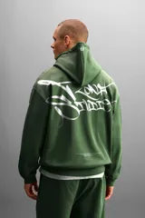 Hoodie gris de corte holgado con efecto desgastado y estampado de graffiti en la espalda.