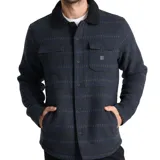 Campera tipo camisa de corte recto con diseño jacquard a rayas horizontales en tonos azul oscuro y negro. Presenta cuello camisero con forro de corderito negro, cierre frontal con botones, dos bolsillos superiores con solapa y bolsillos laterales. Confeccionada en tejido de mezcla de lana y poliéster.