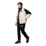 Campera técnica Columbia de la colección Iconos, con diseño impermeable y transpirable Omni-Tech. Presenta un estilo retro con bloques de color en crema y negro, cuello alto con forro interior azul, cierre frontal con solapa protectora y múltiples bolsillos. Incluye sistema de intercambio con cremallera para usar con forro reversible.