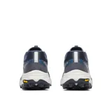 Championes de trail running Merrell modelo Agility Peak 6, color azul y gris con suela blanca y negra. Presentan parte superior de malla transpirable con detalles en TPU, cordones blancos y logo de la marca en el lateral.