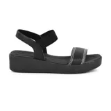 Sandalias azules de cuero con plataforma baja y tiras anchas.