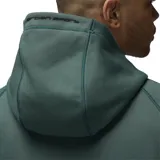 Campera con capucha Jordan Sport Hoop Fleece color verde oscuro, con cierre frontal completo, bolsillos tipo canguro y logo Jumpman bordado en negro en el pecho.