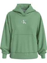 Buzo con capucha de felpa de algodón, color verde, con bolsillo tipo canguro frontal, puños y bajo de canalé, y logo de la marca estampado en el pecho.