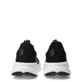 Championes de running Umbro Dynamen para hombre, color negro con suela blanca y detalles plateados en los laterales.