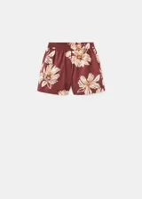Short marrón con estampado floral grande en tonos beige y blanco, de tiro regular y silueta relajada con cintura elástica.