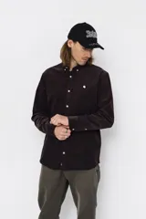 Camisa de pana de algodón manga larga, color negro, con cuello abotonado, cierre frontal con botones y logo bordado en el pecho.