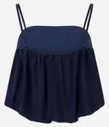 Blusa de tirantes finos ajustables con diseño balonê, confeccionada en tejido jacquard con textura floral y acabado voluminoso.