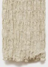 Cardigan de manga larga con textura arrugada, cuello en pico y cierre frontal mediante lazos. Confeccionado en tejido mezcla de algodón.