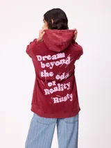 Canguro oversize color negro con efecto lavado, capucha y estampa gráfica en la espalda con tipografía desgastada y detalles en color turquesa.