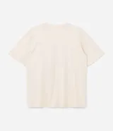 Remera de algodón color crema con cuello redondo y mangas cortas. Presenta un estampado frontal con temática parisina que incluye la palabra 'Paris', un dibujo de una taza de café sobre un croissant y la frase 'Croissant & Crème'.