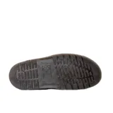 Zapatos slingback Dr. Martens modelo Jorge II, color negro, de gamuza con tira ajustable con hebilla y suela gruesa con costura amarilla característica de la marca.