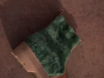 Botas de cuero marrón con la caña recubierta de corderito verde. Presentan una suela de plataforma tipo track en color beige y un tirador en la parte posterior para facilitar el calce.