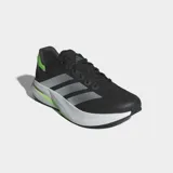 Championes de running Adidas modelo Duramo Speed 2, color negro con las tres tiras en plateado y detalles en verde lima. Cuentan con una parte superior de malla técnica transpirable, amortiguación Lightstrike ligera y suela de TPU y caucho para mayor tracción.