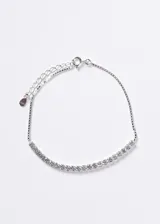 Pulsera de plata 925 semi sin fin con incrustaciones de zirconias cúbicas transparentes en la parte frontal y cadena veneciana con extensión ajustable.