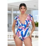 Malla enteriza de diseño estampado con motivos tropicales en tonos azul, fucsia y verde sobre fondo blanco, con escote en V y volados en las mangas.