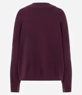 Buzo suéter de tricot con cuello redondo y puños ajustados, de diseño clásico y versátil.