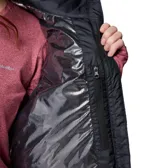 Chaleco acolchado Columbia de color negro con cuello alto, cierre frontal y bolsillos laterales con cremallera. Cuenta con tecnología térmica reflectante Omni-Heat y aislamiento sintético reciclado.
