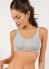 Soutien de microfibra sin costuras, con diseño de breteles anchos y banda elástica reforzada para mayor sujeción. Modelo sin aros ni copas preformadas.